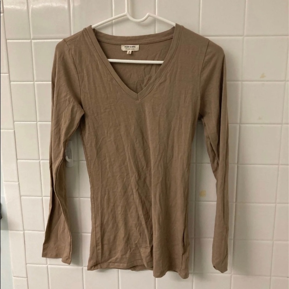 A tan long sleeved top